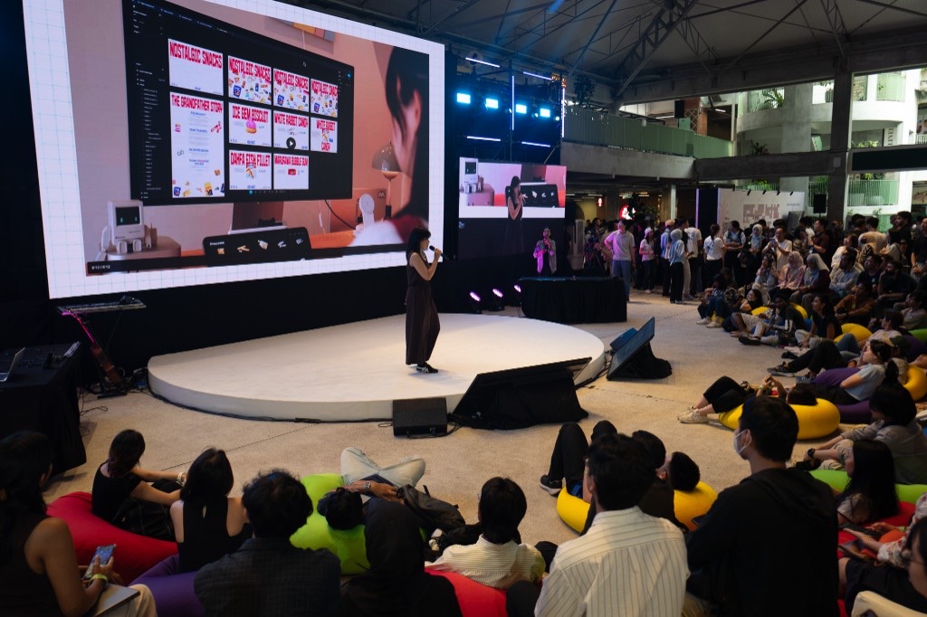 Rachel How speaking on stage